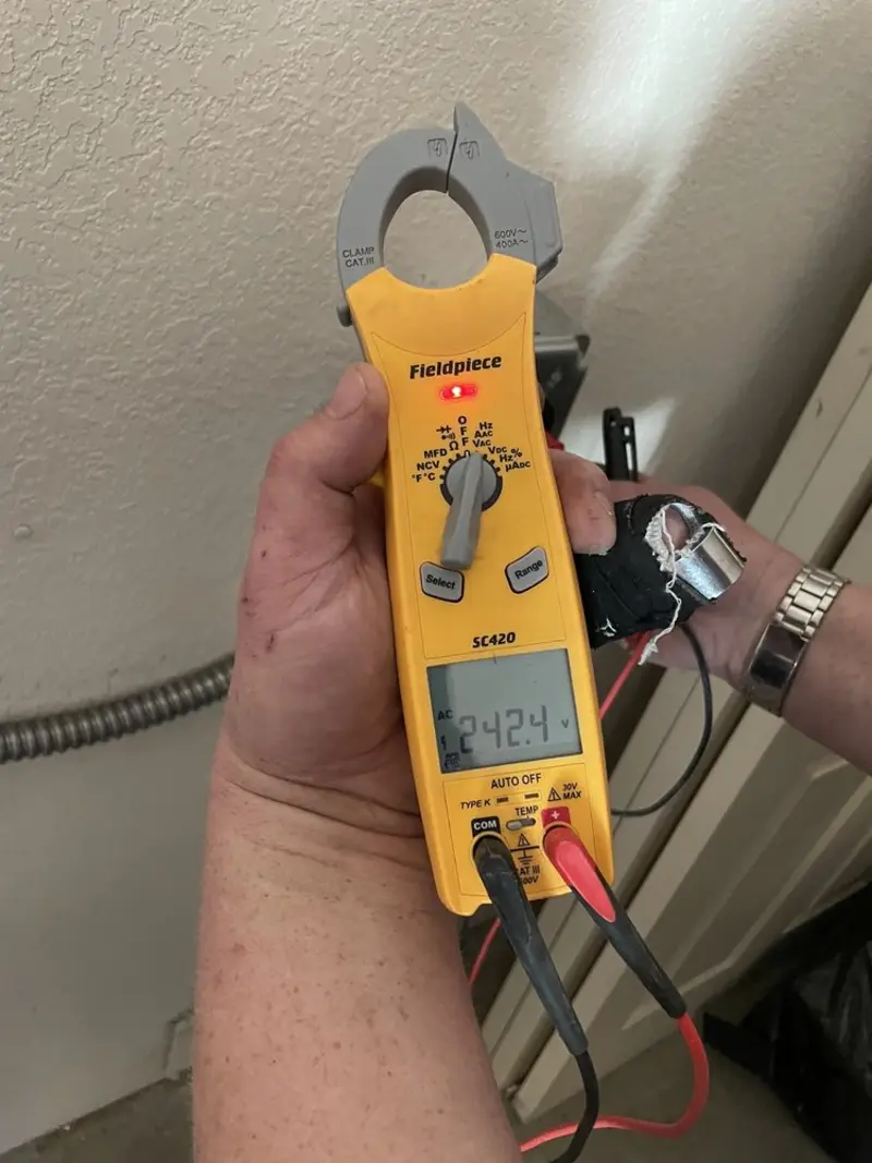 Voltage testing with clamp meter during Recessed Lighting Installation in Leakesville